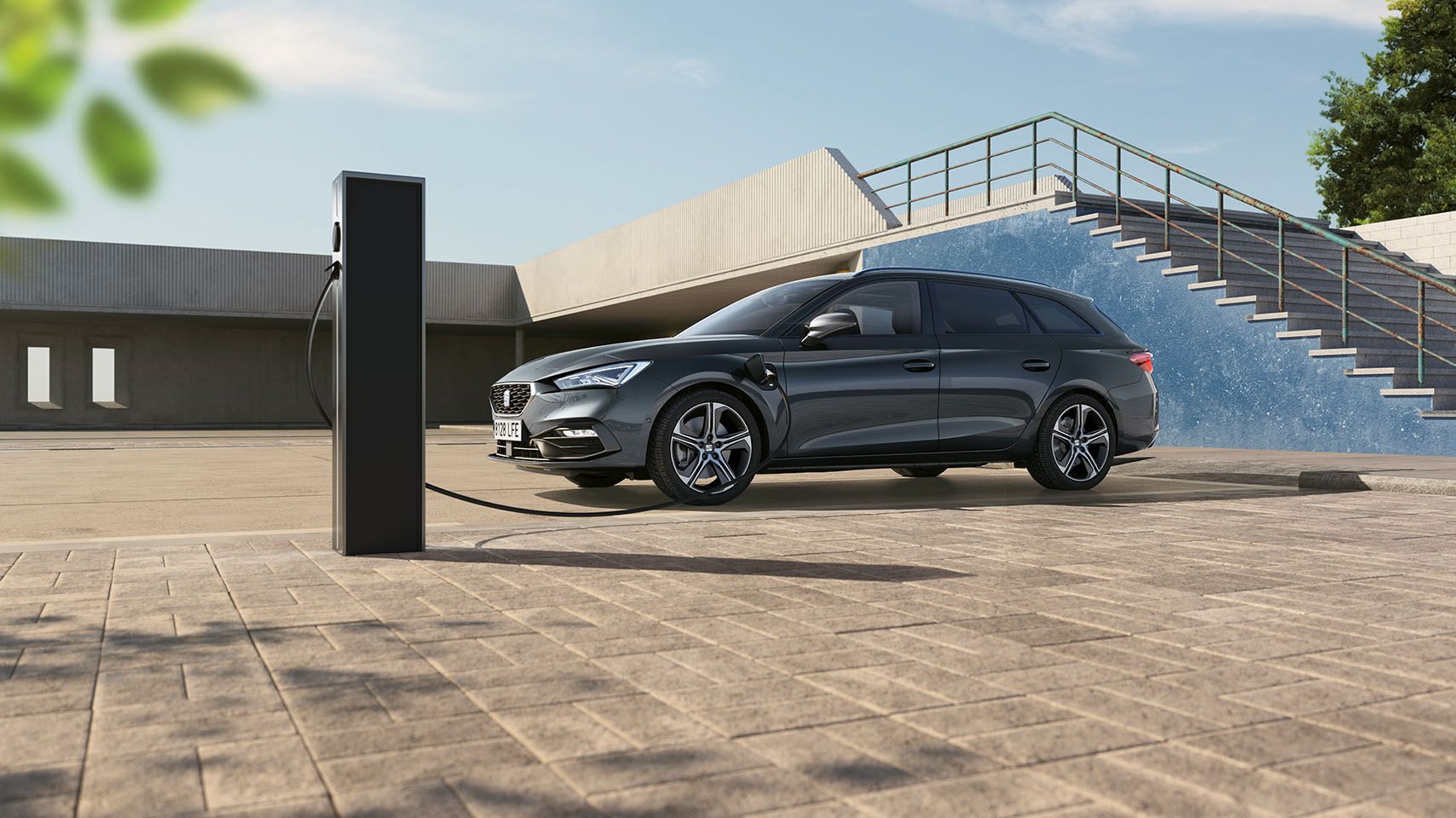 Seat leon sportstourer side shot charging at public car park