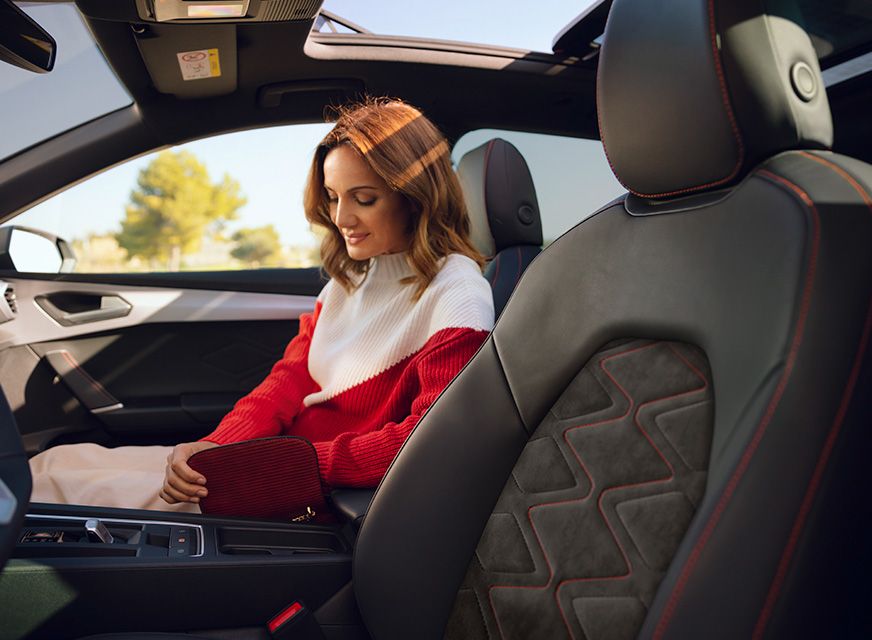 woman sitting in the passenger seat, enjoying the seat interior